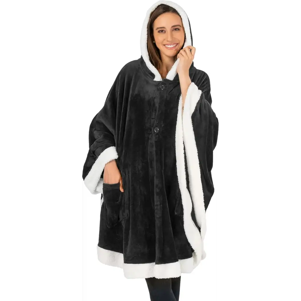 Cozy black fleece wearable blanket with white sherpa trim and button closures
