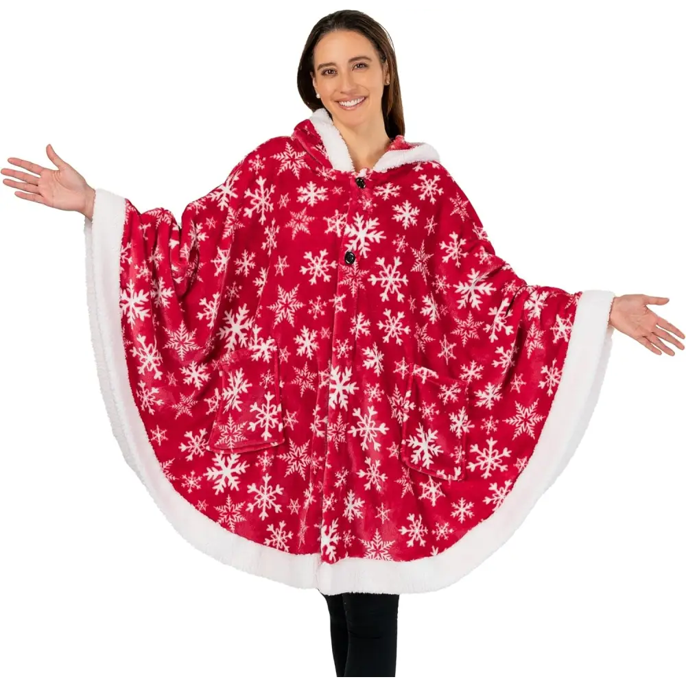 Red fleece wearable blanket poncho with white snowflake pattern and furry trim