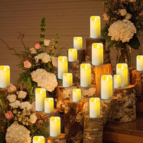 Multiple LED flameless candles with real flame effect on rustic wood logs and floral decor