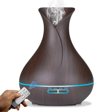 Dark brown essential oil diffuser with remote and glowing blue light strip