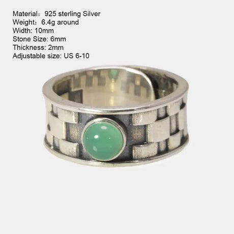 Sterling silver ring featuring a geometric pattern and natural jade stone centerpiece