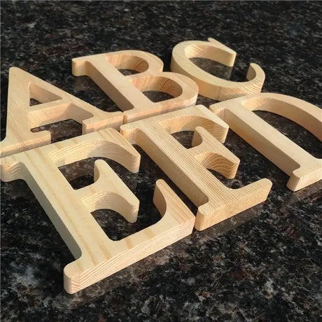 Wooden letters spelling ABC EFT in unfinished wood, perfect gift for home decor