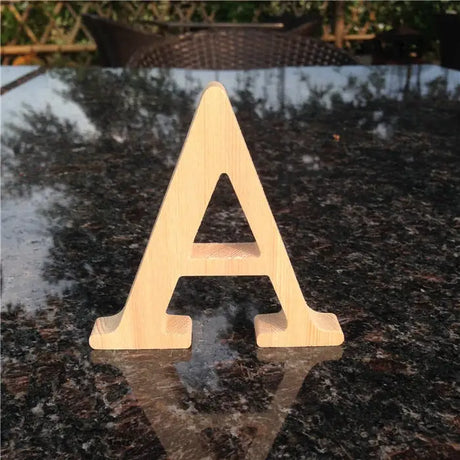 Wooden letter A in serif font style perfect for photo frames or unfinished wood letters